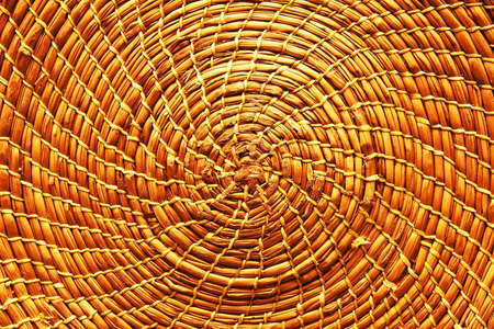 Circular background from rattan fibers. Wicker texture close-up photo. (filter image)の写真素材