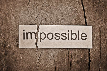 Changing word impossible transformed to possible. Conceptual of successfully overcoming problems.の写真素材
