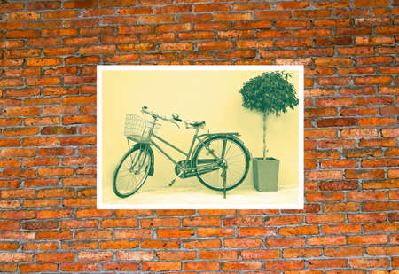 Vintage bicycle photo on brick wall.の写真素材