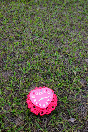 Valentines day background with red clock shaped heart.の写真素材