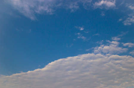 Blue sky background with clouds.の写真素材