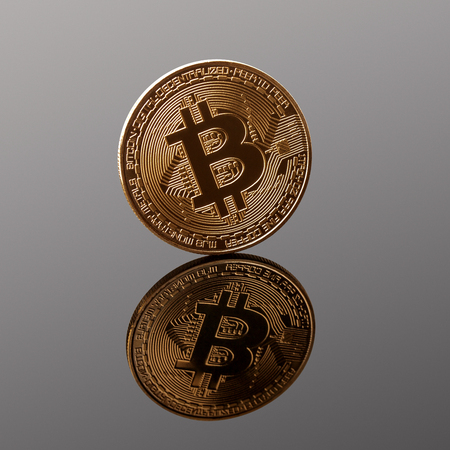bitcoin, golden coin isolated on dark background, clipping pathの写真素材