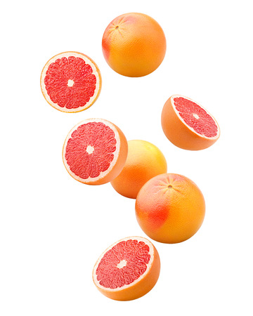 Falling grapefruits isolated on white background, clipping path, full depth of fieldの写真素材