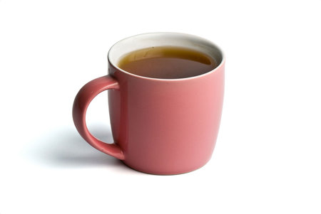 Teacup full of black tea isolated on white backgroundの写真素材