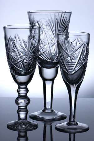 Group of tree tall wine glasses on illuminated backgroundの写真素材