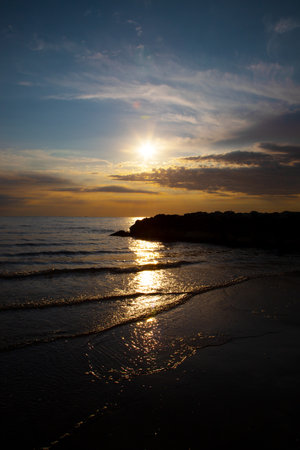 Sunset on the beach of the Baltic Sea in Kolobrzegの写真素材
