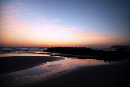 Sunset on the beach in San Sebastian, Galicia, Spainの写真素材