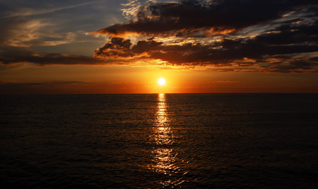 Beautiful sunset over the sea. Sunset on the sea. The sun goes down.の写真素材