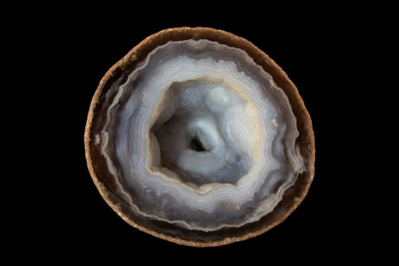 Macro shooting of natural mineral rock specimen - Agate gemstone isolated on black backgroundの写真素材