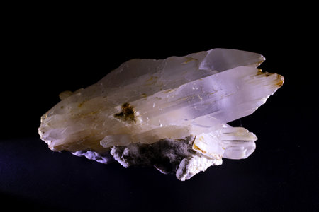 closeup of sample of natural mineral from geological collection - chalcedony quartz on black backgroundの写真素材