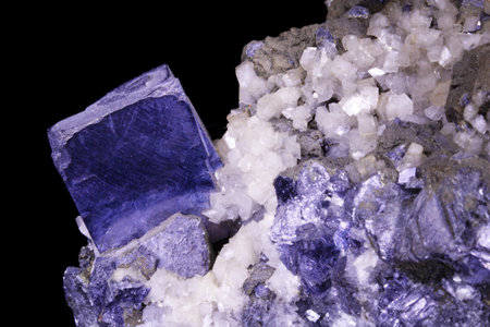 macro shooting of natural mineral from geological collection - raw Amethyst stone on black backgroundの写真素材