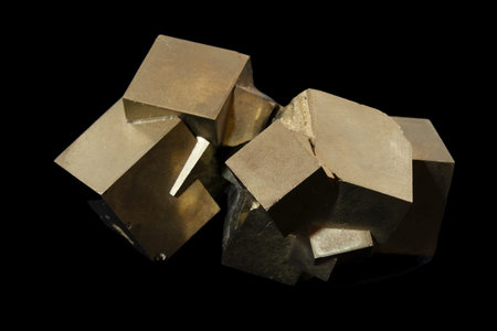 golden pyrite mineral isolated on black background close-up