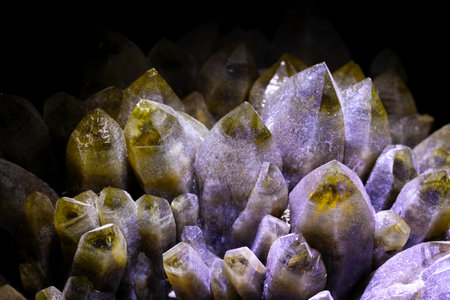 macro shooting of natural mineral rock specimen - quartz crystals on black backgroundの写真素材
