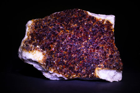 macro shooting of natural mineral rock specimen - quartz crystals on black background