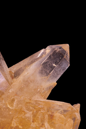 Macro shot of a crystal of quartz on a black background.の写真素材