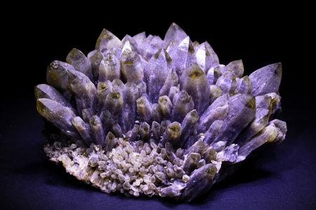 Amethyst crystals on a black background. Macros. Natural stone.の写真素材