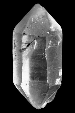 A close up shot of a natural quartz gemstone on a black backgroundの写真素材