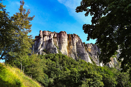 Rock formation in the mountains. The Breathtaking Beauty of the Tuscan-Emilian Apennine Hills with Bismantova Rock in the Distanceの写真素材