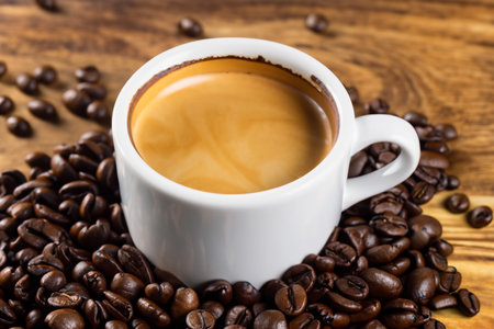 Coffee cup and coffee beans on wooden table. Top viewsの写真素材