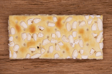 Crispy crackers with peanuts on a wooden background. Top viewsの写真素材