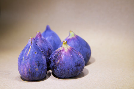 Three figs on a light background. Selective focus. Toned.の写真素材