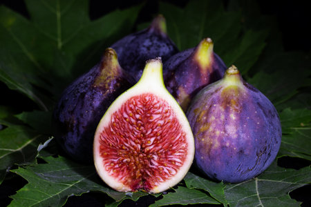 Fresh figs on a dark background. Selective focus. Toned.の写真素材