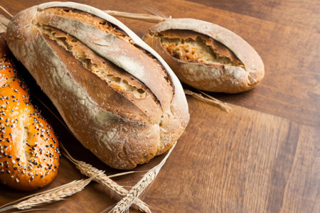 Rustic Homemade Artisan Bread on Antique Wooden Table, Food Photography Printの写真素材