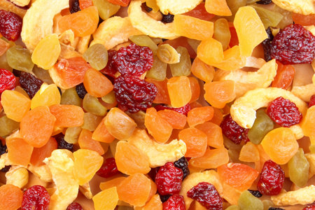 background of dried fruits, closeup of a pile of dried fruitsの写真素材