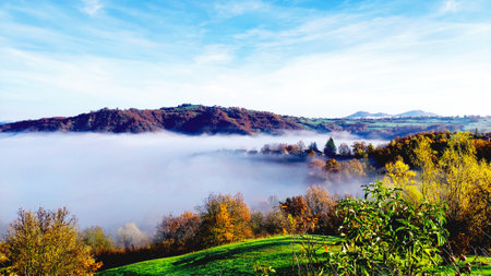 Foggy morning in the mountains. Colorful autumn landscape.の写真素材
