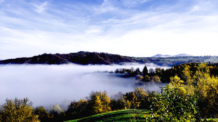 Foggy morning in the mountains. Autumn landscape with fog.の写真素材
