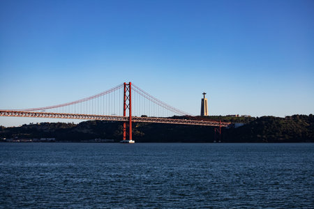 The 25th of April Bridge in Lisbon, Portugal on a sunny day.の写真素材