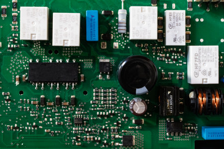 Close-up of electronic circuit board with microchips and capacitorsの写真素材