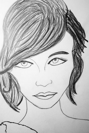 Sketch of a beautiful girl's face. Drawing on paper.の写真素材