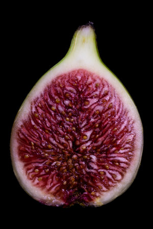 Figs on a black background. Close-up. Studio photography.