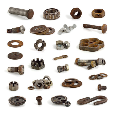 Different metal parts and tools on white background.