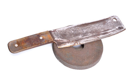 Hatchet with Old abrasive wheel isolated on white background.の写真素材