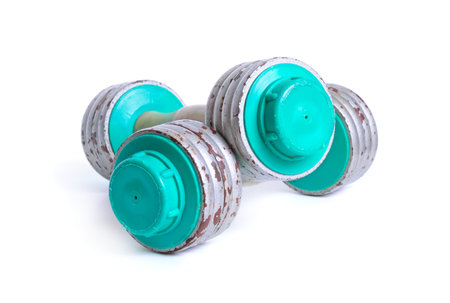 A pair of vintage dumbbells isolated on white.