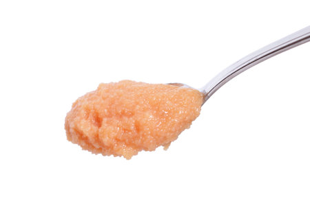 Pollock caviar in the spoon isolated on white background.