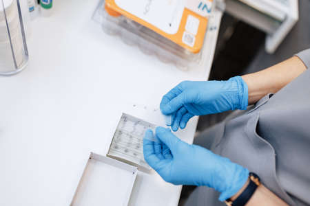 Doctor, nurse, scientist holds tests for the virus in the handsの写真素材