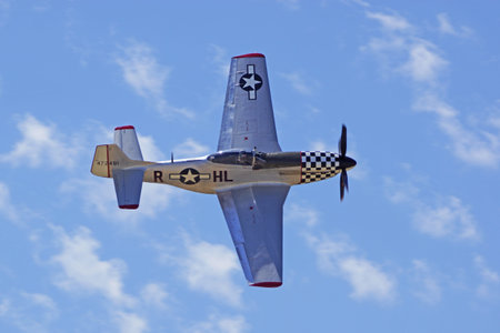 AirplaneVintage P51 Mustang WWII aircraft flying at Air Show
