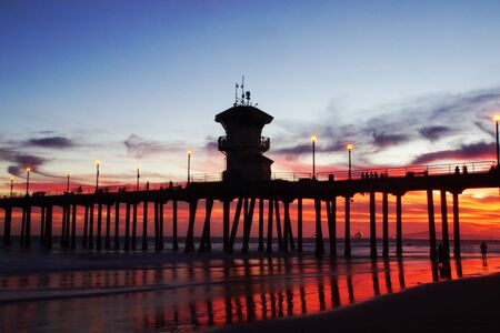 Beach Pier at Sunset with tower silhouetteの写真素材