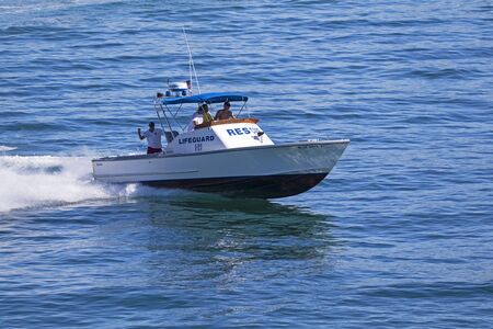 Life guard boat patrolling at 2016 beach air showのeditorial素材
