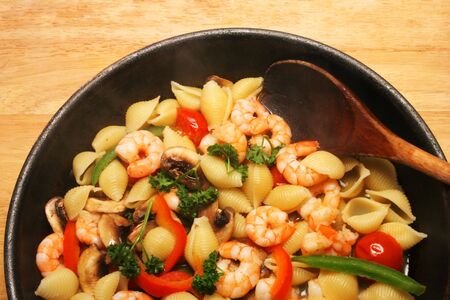 Cooked prawns and pasta in a panの写真素材