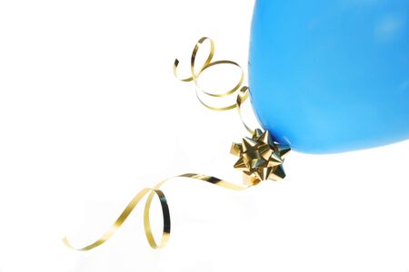 Blue balloon with gold foil bow and ribbonの写真素材