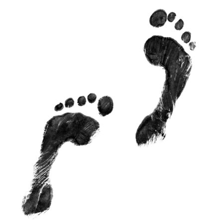 Impression of a pair of feet in black inkの写真素材