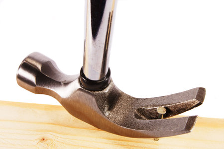 A claw hammer head with nailの写真素材