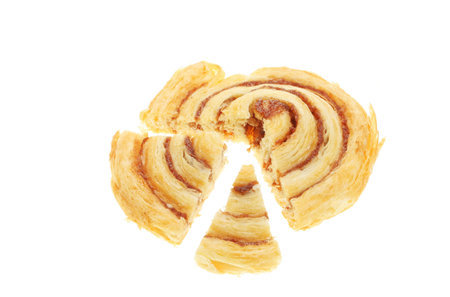 Danish pastry cut into sections to form a pie chartの写真素材