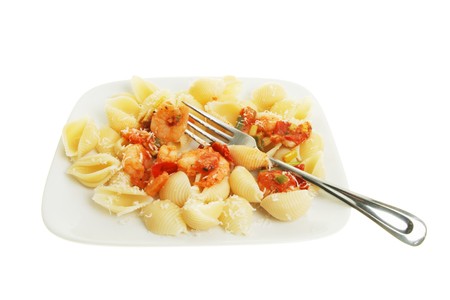 Pasta and prawns with a fork on a plateの写真素材