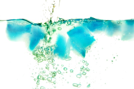 Abstract patterns created by bubbles in water and blue tinted iceの写真素材