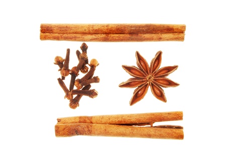Cinnamon star anise and cloves spice isolated on white の写真素材